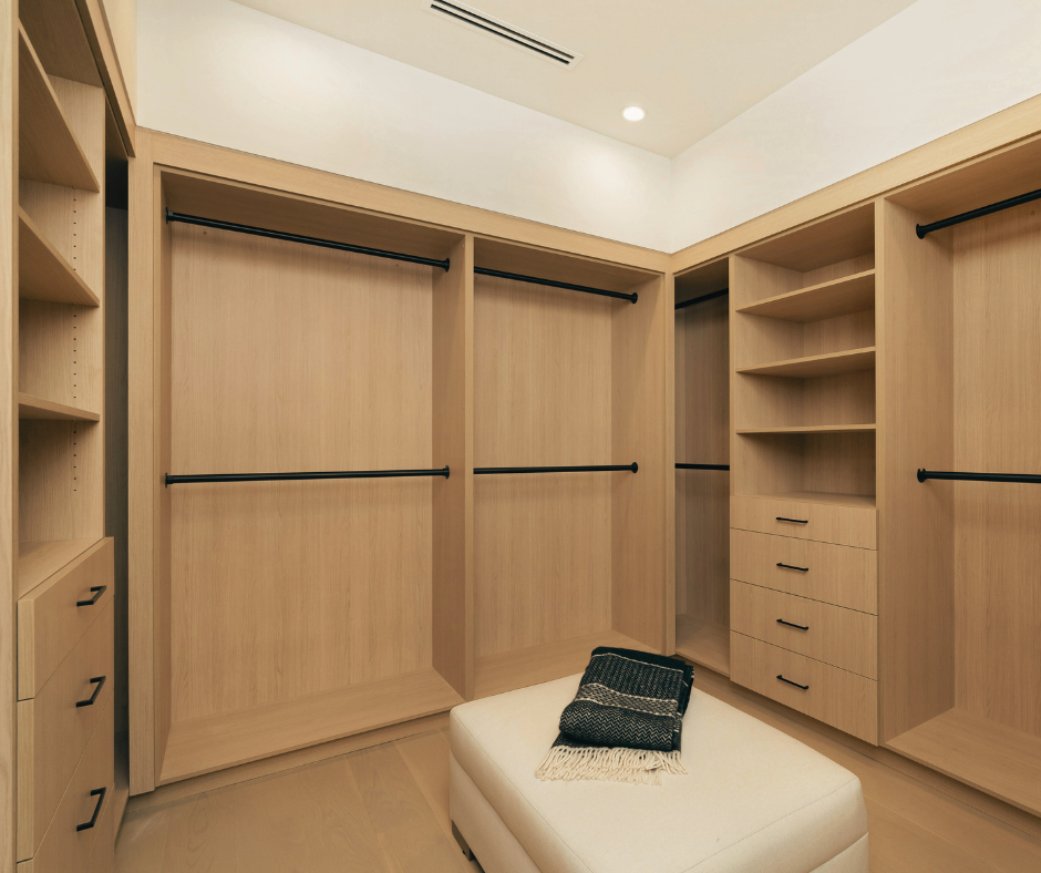 Custom built-in closet with shelving, drawers, and island bench